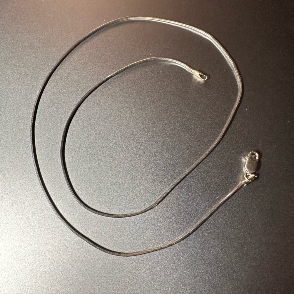 White gold 16” -14 K necklace. Beautiful on it’s on or with a pendent.